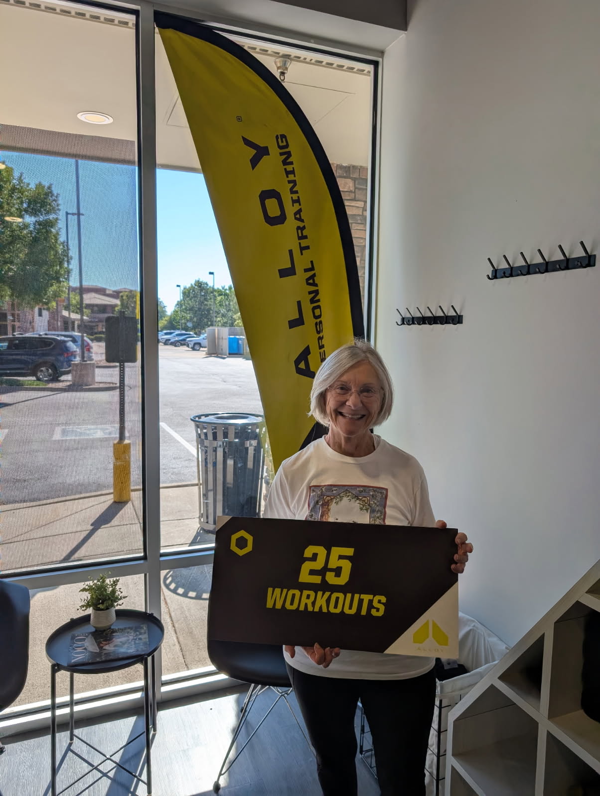 Member celebrating 25 workouts